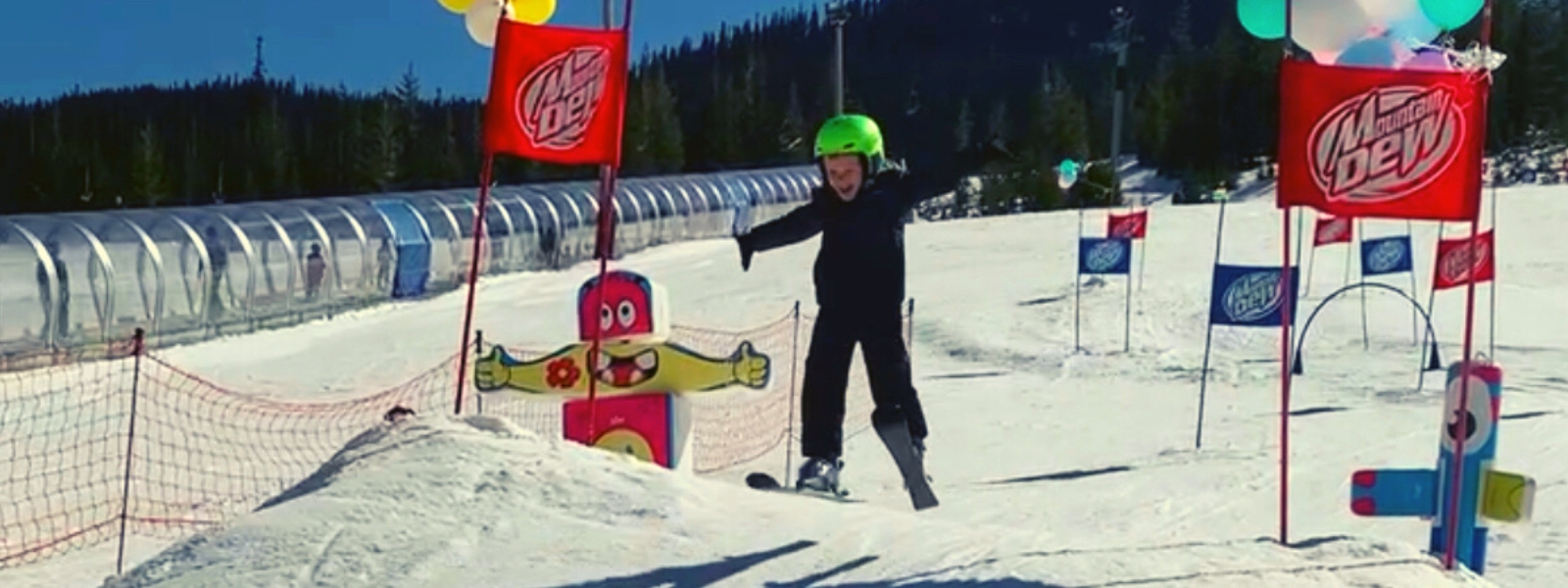 Child skiing over jump
