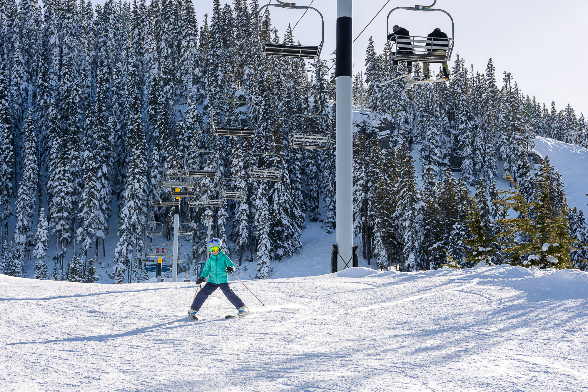 snowplow skier under chairlift