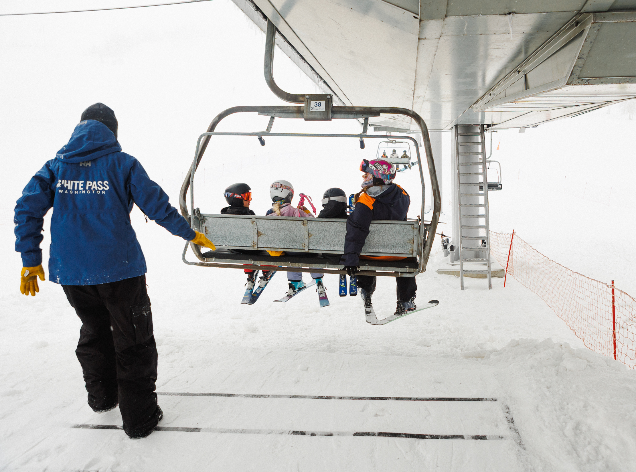 liftie guiding a chair